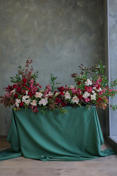  Luxurious red roses tribute casket spray with garden blooms in red, cream, dusty pinks, and deep greens by Ottawa florist.