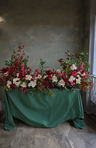  Luxurious red roses tribute casket spray with garden blooms in red, cream, dusty pinks, and deep greens by Ottawa florist.