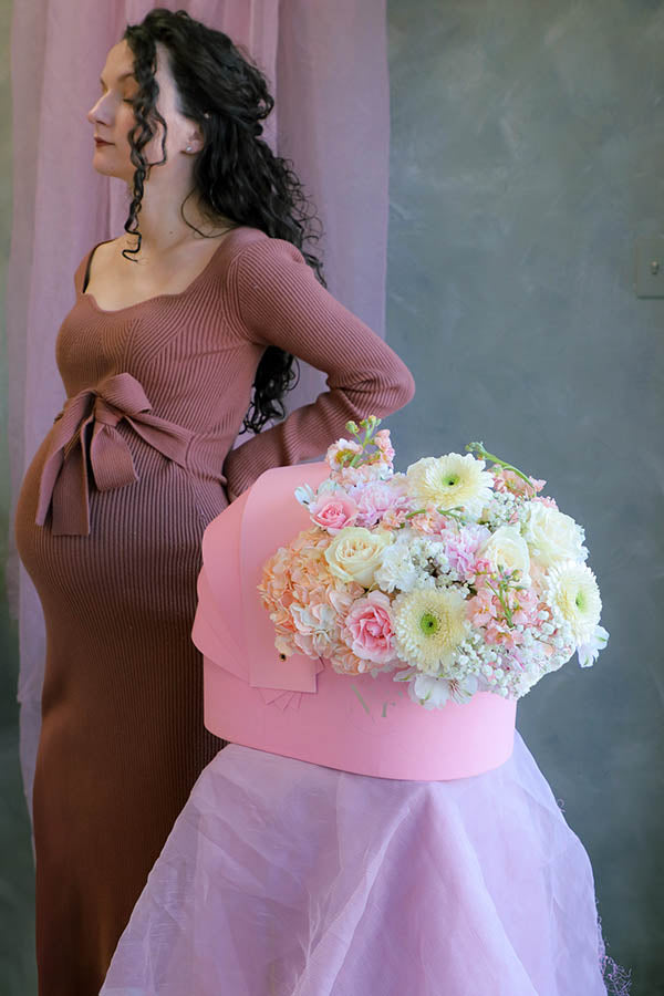 pink baby girl flowers; pink flower crib; flowers in a crib; baby girl flower arrangement; baby shower flowers 