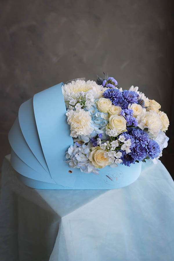 flower crib; flowers in a crib; baby boy flowers; blue flower bouquet; baby boy arrangement