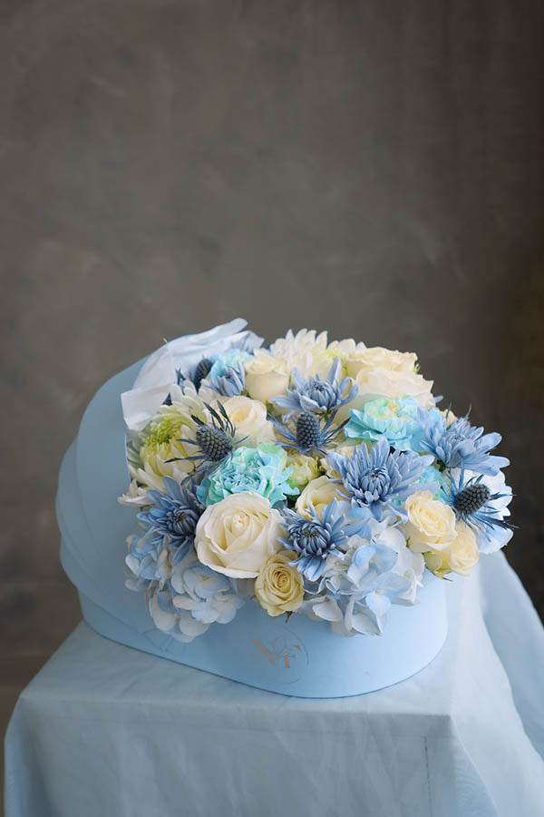 flower crib; flowers in a crib; baby boy flowers; blue flower bouquet; baby boy arrangement