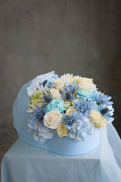 flower crib; flowers in a crib; baby boy flowers; blue flower bouquet; baby boy arrangement