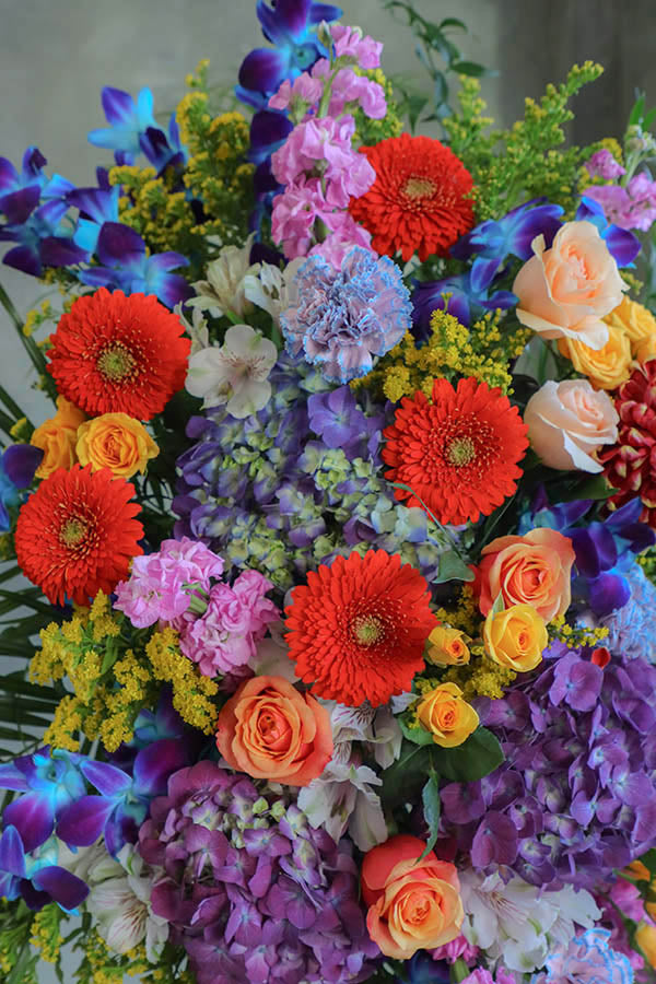 colorful funeral standing spray; cheerful funeral flowers; funeral spray; funeral flowers ottawa