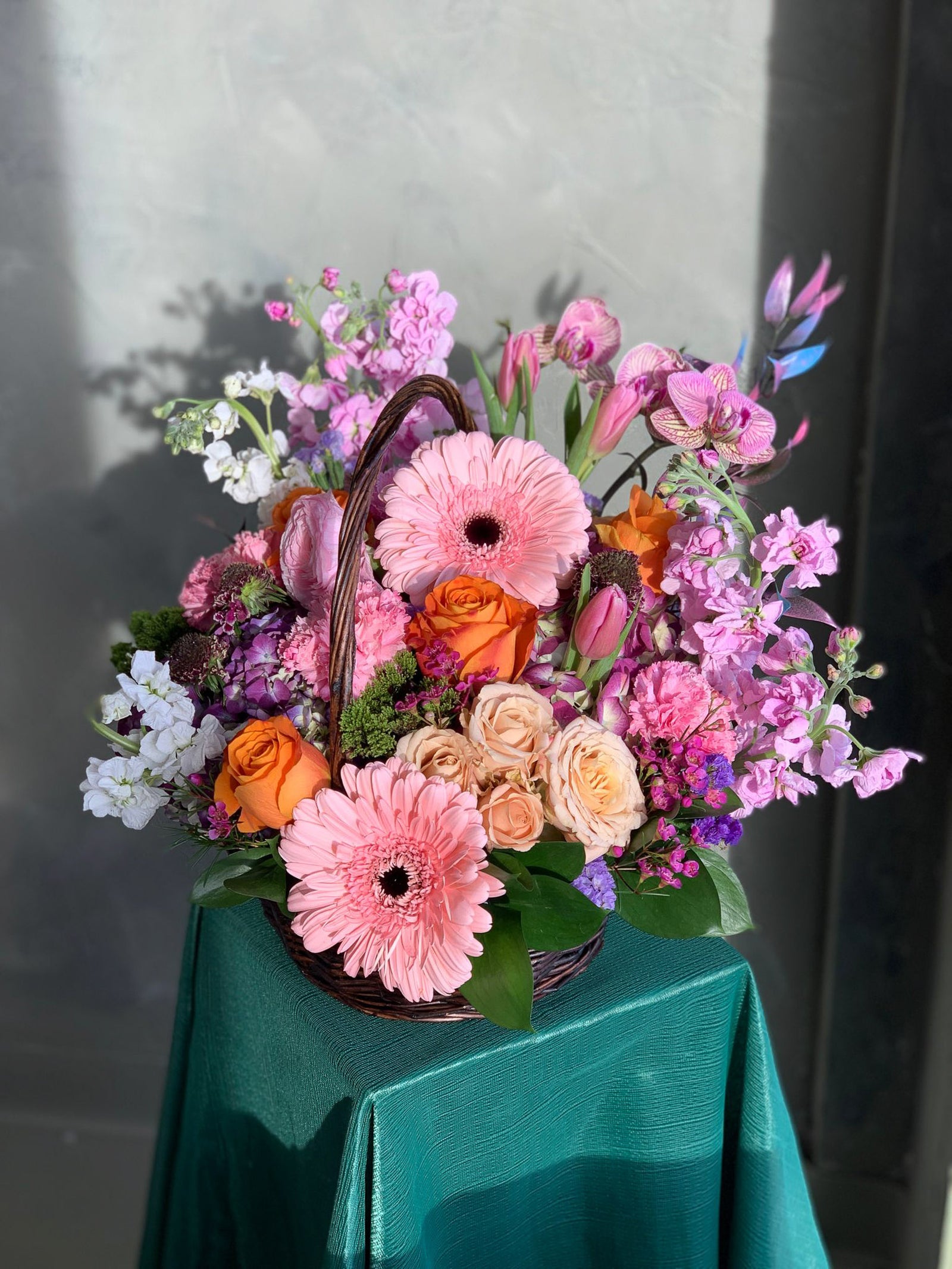 bright pastel flower basket with spring flowers
