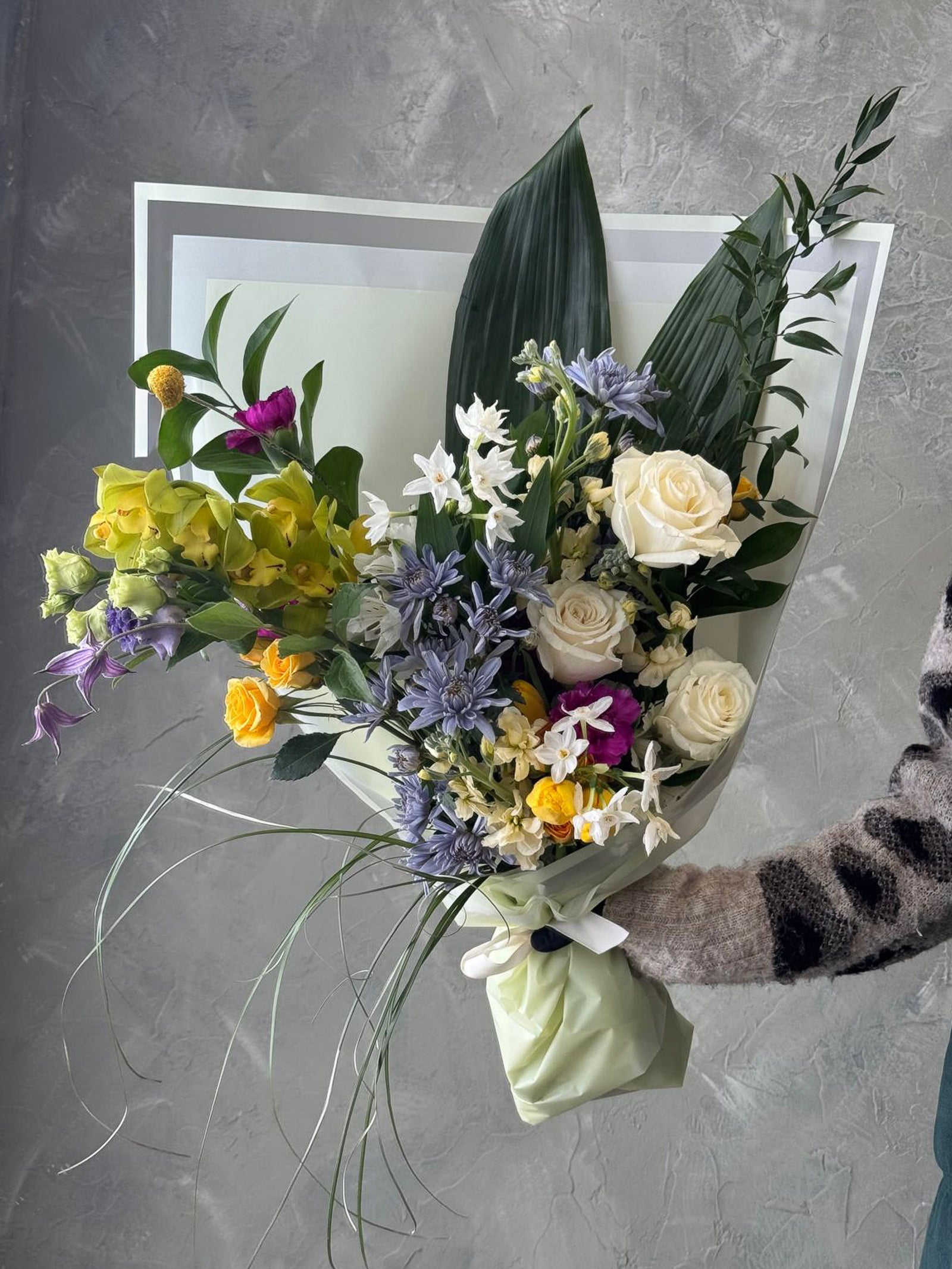 spring happy bouquet with yellow blue white flowers