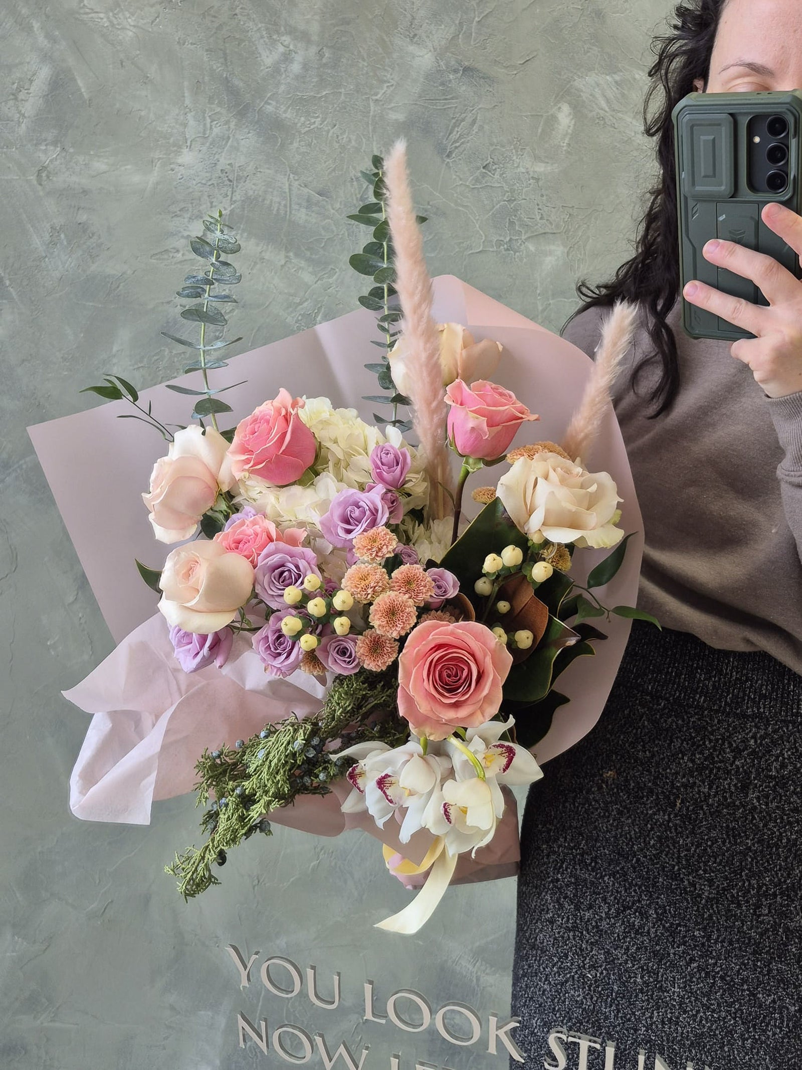 Romantic flower bouquet in lavender, pinks and whites with pink roses and white orchid