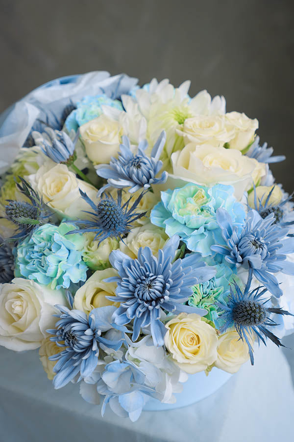 flower crib; flowers in a crib; baby boy flowers; blue flower bouquet; baby boy arrangement