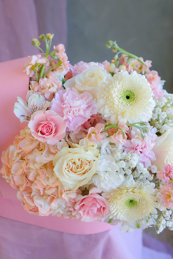 pink baby girl flowers; pink flower crib; flowers in a crib; baby girl flower arrangement; baby shower flowers 