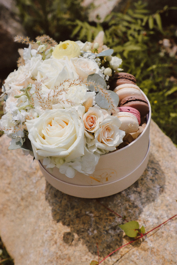 Creamy Dreamy Flower Macaron Box with white and cream flowers, lush greenery, and local macarons by Ottawa florist.