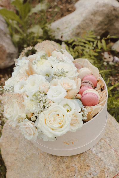 Creamy Dreamy Flower Macaron Box with white and cream flowers, lush greenery, and local macarons by Ottawa florist.