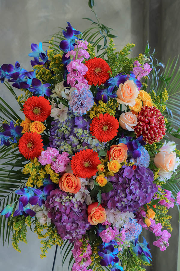 colorful funeral standing spray; cheerful funeral flowers; funeral spray; funeral flowers ottawa