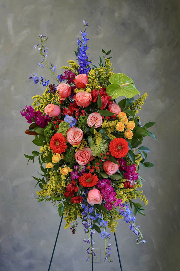 colorful funeral standing spray; cheerful funeral flowers; funeral spray; funeral flowers ottawa