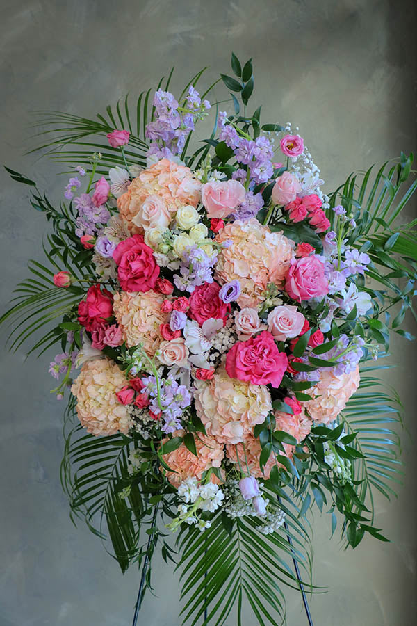 delicate funeral flowers; funeral standing spray; white and pink lavender funeral flowers; flower delivery ottawa