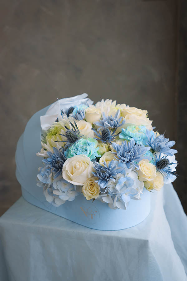 flower crib; flowers in a crib; baby boy flowers; blue flower bouquet; baby boy arrangement