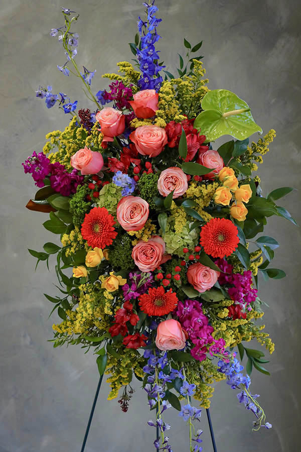 colorful funeral standing spray; cheerful funeral flowers; funeral spray; funeral flowers ottawa