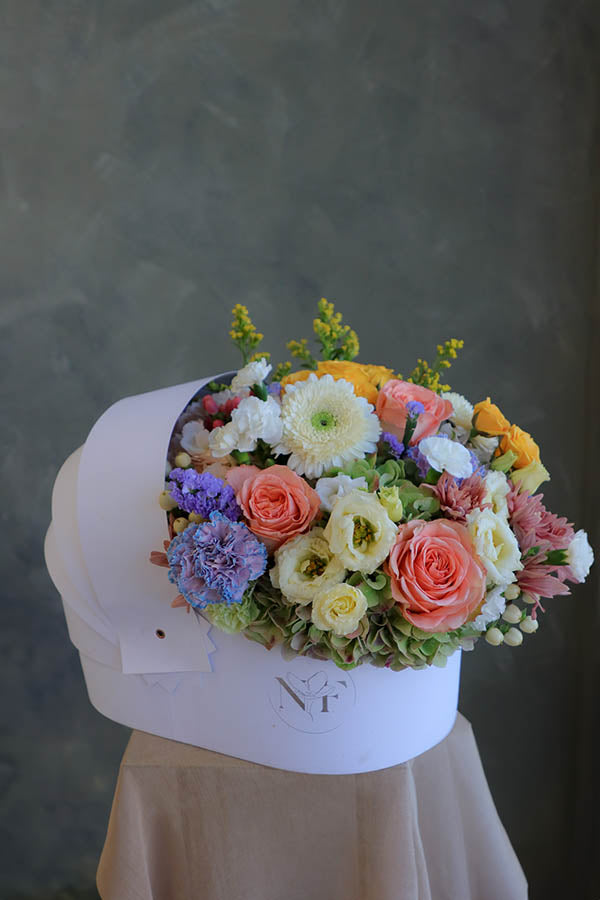 baby flowers; gender neutral flowers; flowers for a birth of a baby; flower crib; flowers in a crib