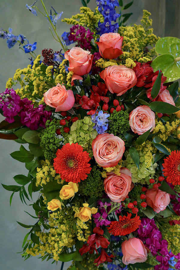 colorful funeral standing spray; cheerful funeral flowers; funeral spray; funeral flowers ottawa