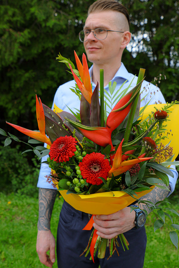 Vibrant Tropical Paradise bouquet with bright gerberas, heliconias, and lush tropical foliage by Ottawa florist.