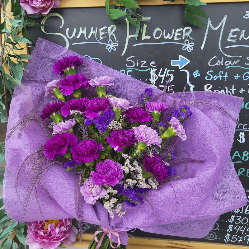 small bouquet; purple flowers; purple bouquet; bouquet of purple carnations