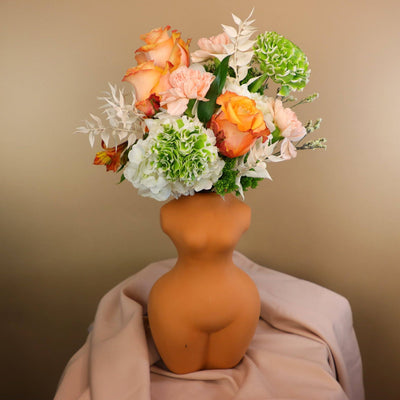female vase; woman vase; gorgeous flowers in ceramic vase; ranunculus arrangement 