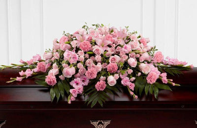 luxurious pink roses casket spray; pink flowers for funerals